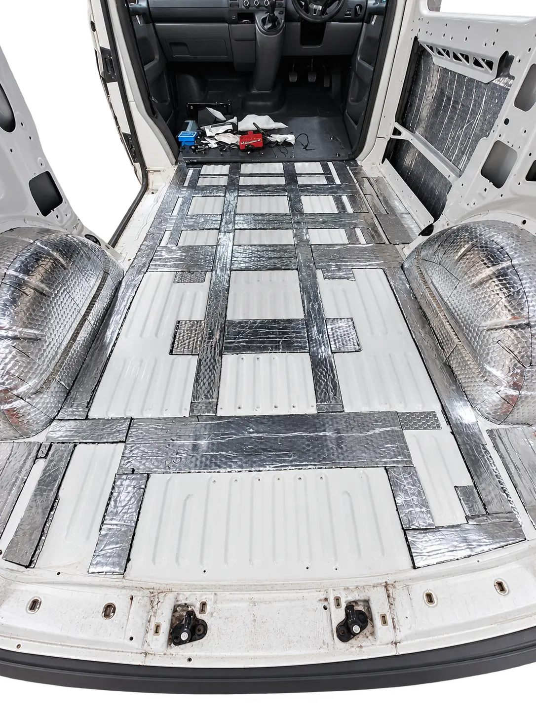 Butyl sound deadening applied to the floor, wheel arches and side panels of a stripped VW Transporter